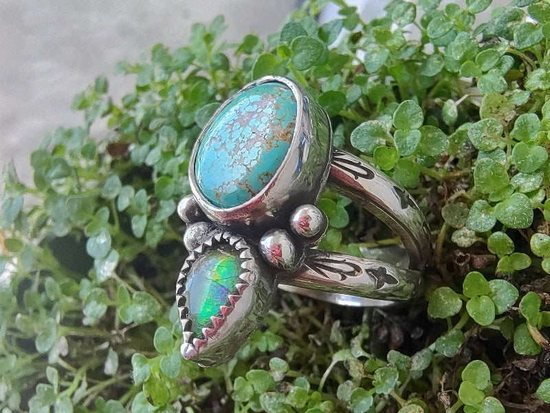 Handmade turquoise and ammolite ring in sterling, sitting upon a bed of Corsican mint.