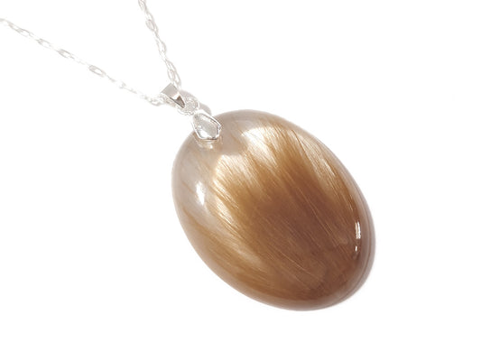 Handmade large oval shaped pendant memorializing a loved one with hair