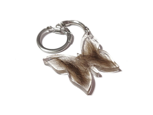 A butterfly shaped keepsake key chain with fur