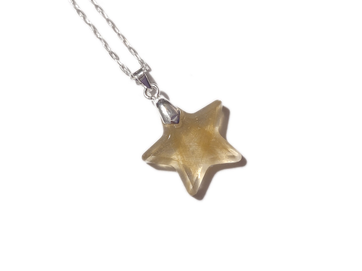 A small star shaped pendant encapsulating s lock of hair