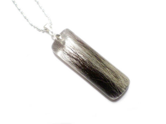 A handmade bar shaped memorial necklace with loved ones hair