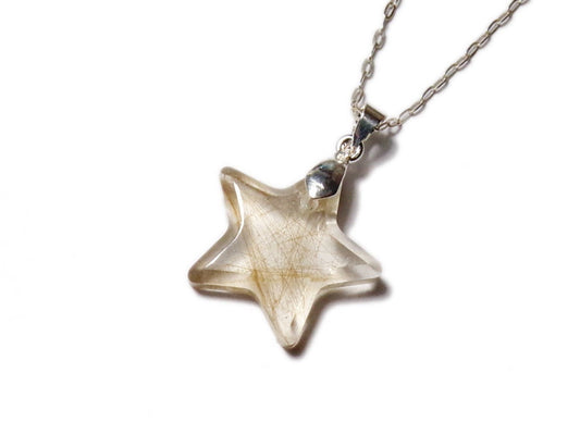A small star shaped pendant encapsulating s lock of hair