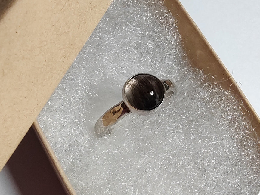 Silver hair locket keepsake ring in giftbox.