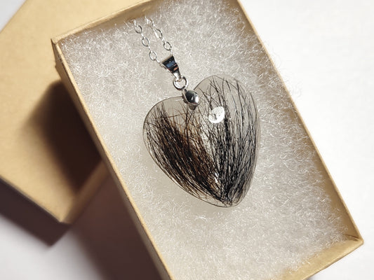 Heart shaped hair keepsake pendant in gift box.