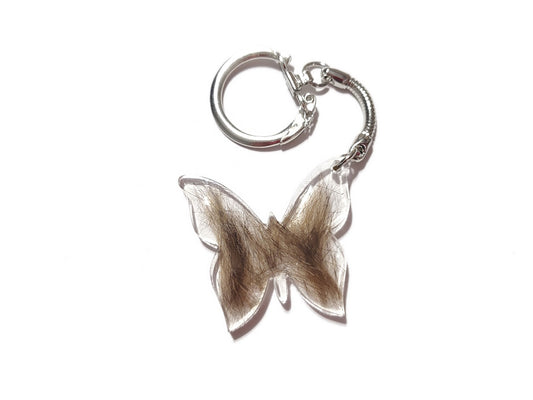 A butterfly shaped keepsake key chain with fur