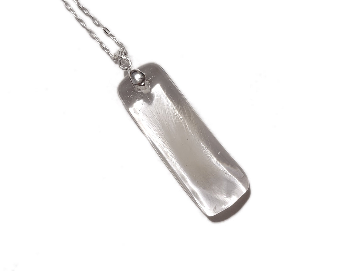 Handmade memorial pendant containing hair lock.