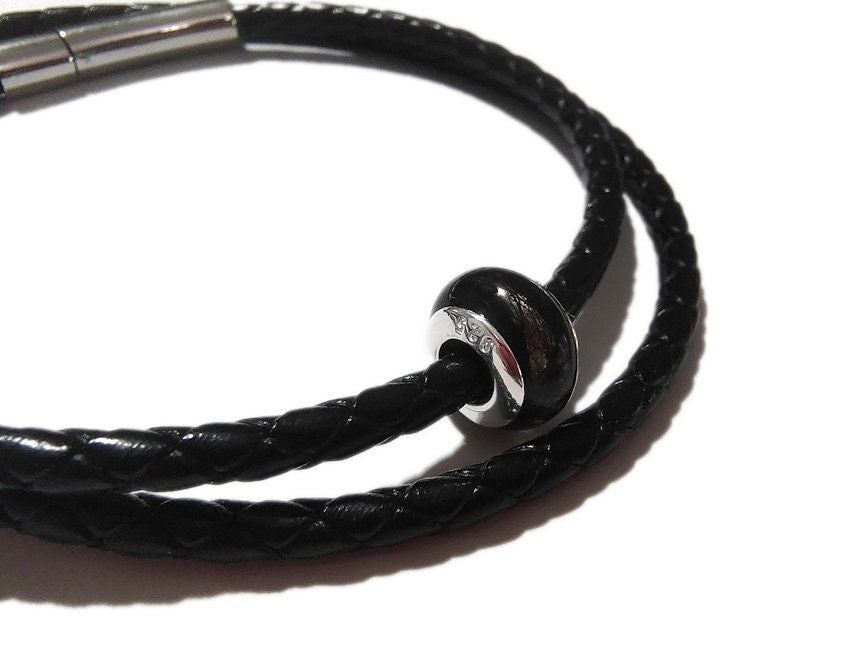 mens style braided bracelet with handmade keepsake bead with sterling rivets.