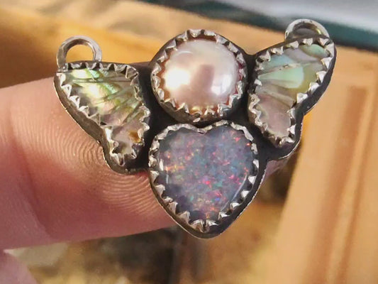 Close up video showing this pendant in shifting indoor, then natural outdoor light. 