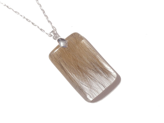 a rectangle shaped keepsake necklace with hair  or fur