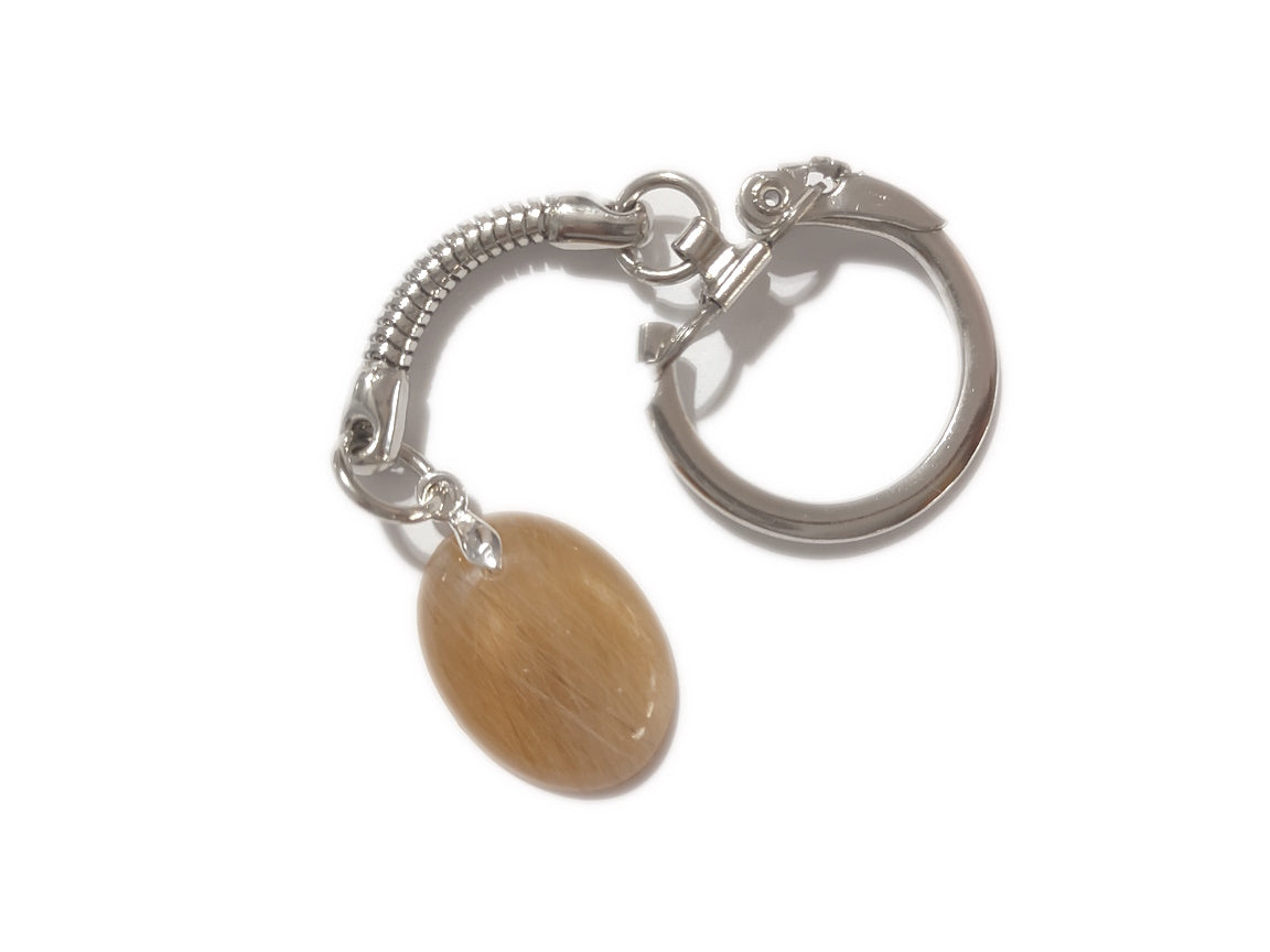 A small oval keepsake key chain with fur