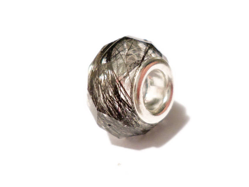A handmade faceted euro bead  containing a loved ones hair, fur, or ash.